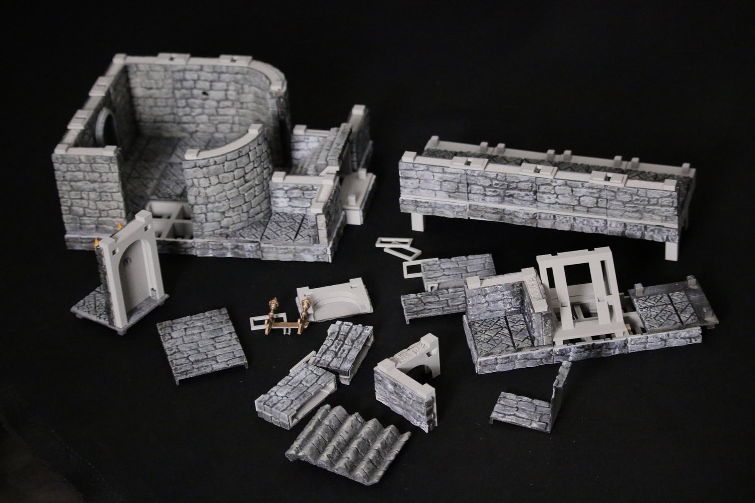 Assembly of the walls, stairs and tiles of the Omega Terrain using easy to snap on and off covers