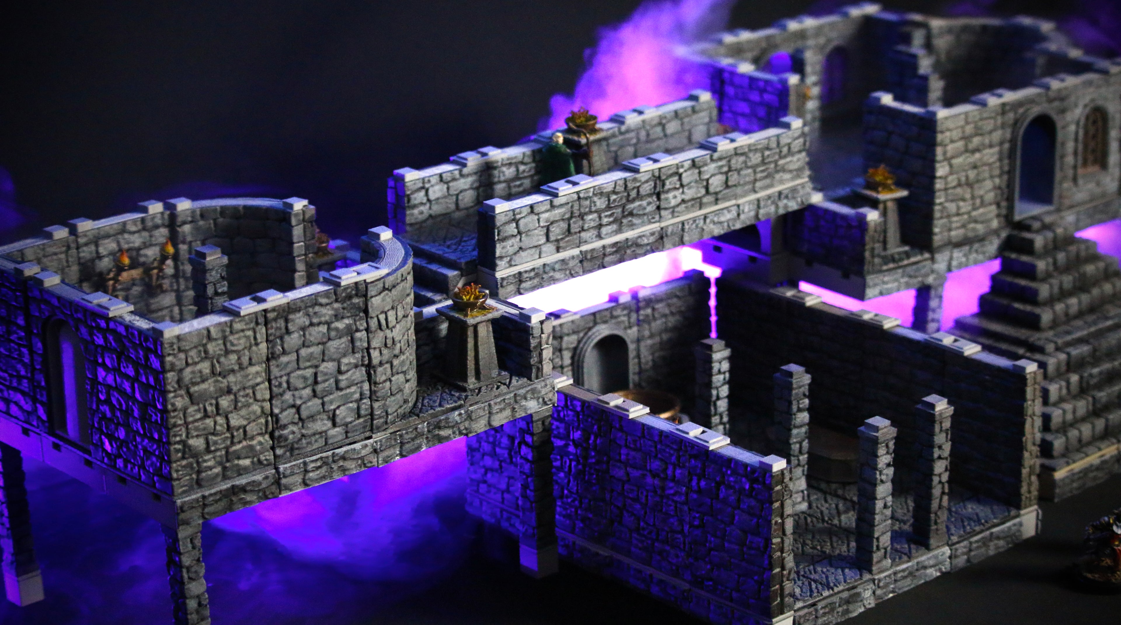 Omega Terrain model of two floating castle rooms, connected by a long bridge which runs over a third room with pillars. Blue hues in the background