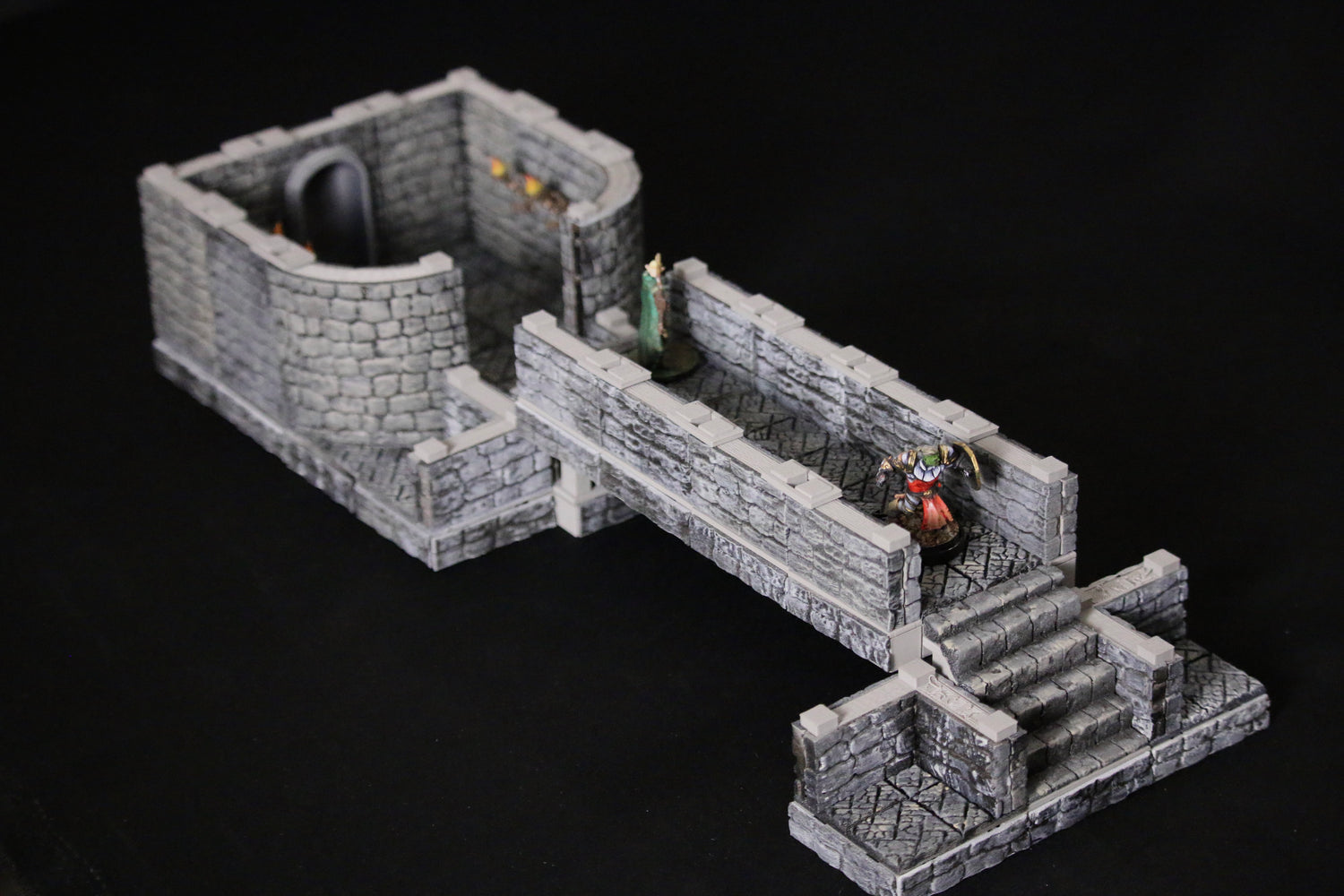 The omega terrain system assembled into a small room, a bridge and two miniatures showing the ease f construction